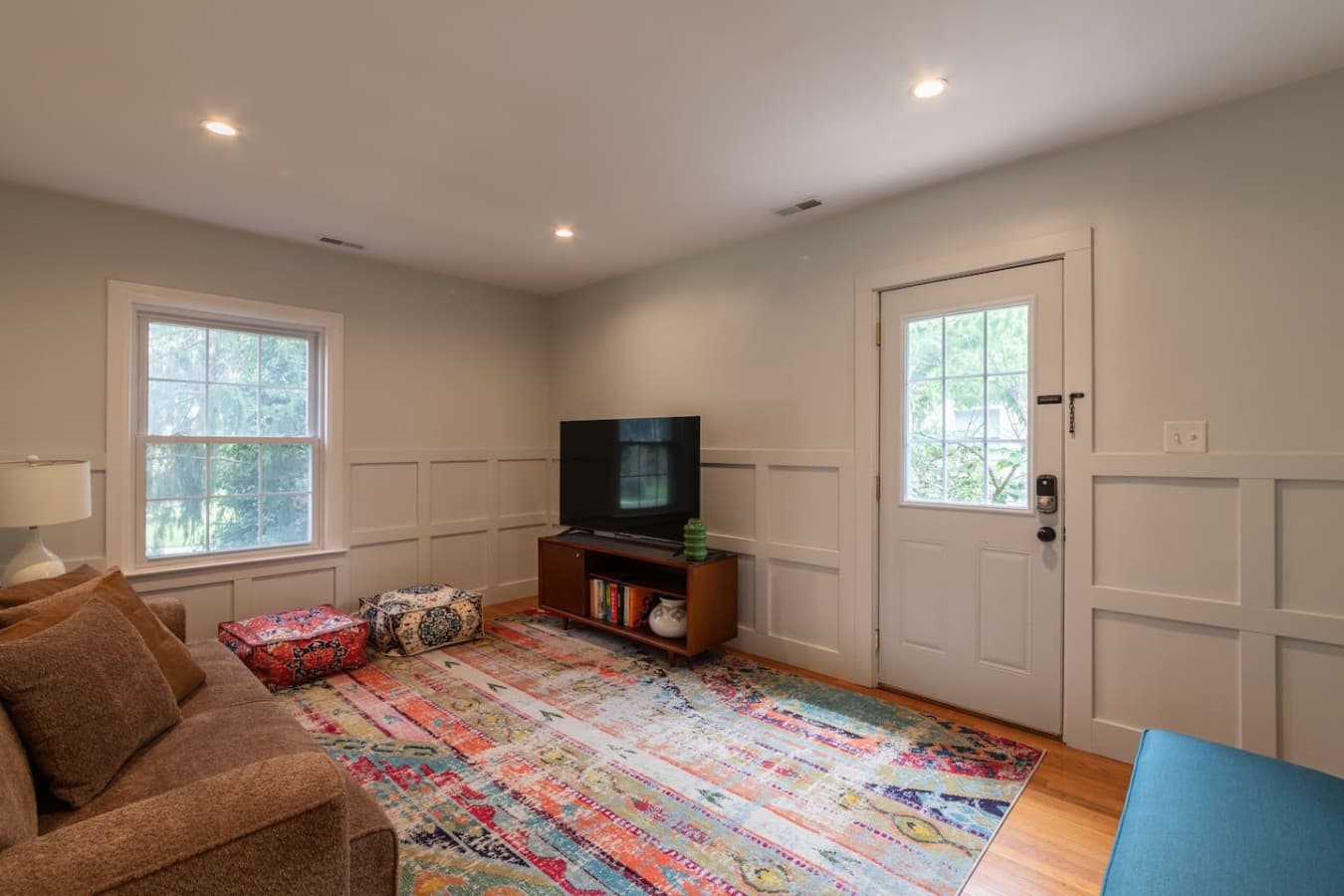 Comfortable living area with TV, natural light, and room to relax.