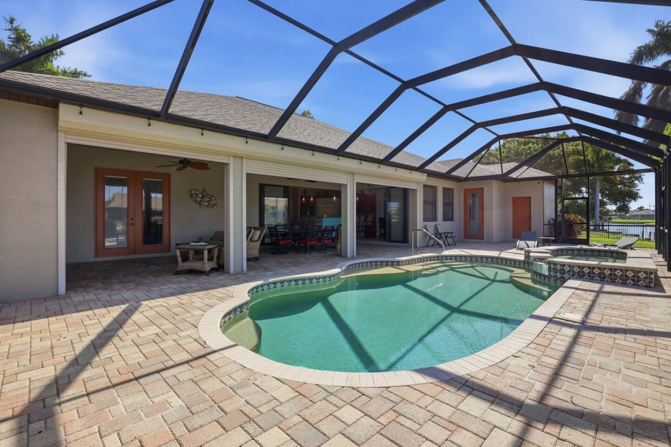 Spacious outdoor pool area with plenty of room to relax and enjoy the Florida sunshine.