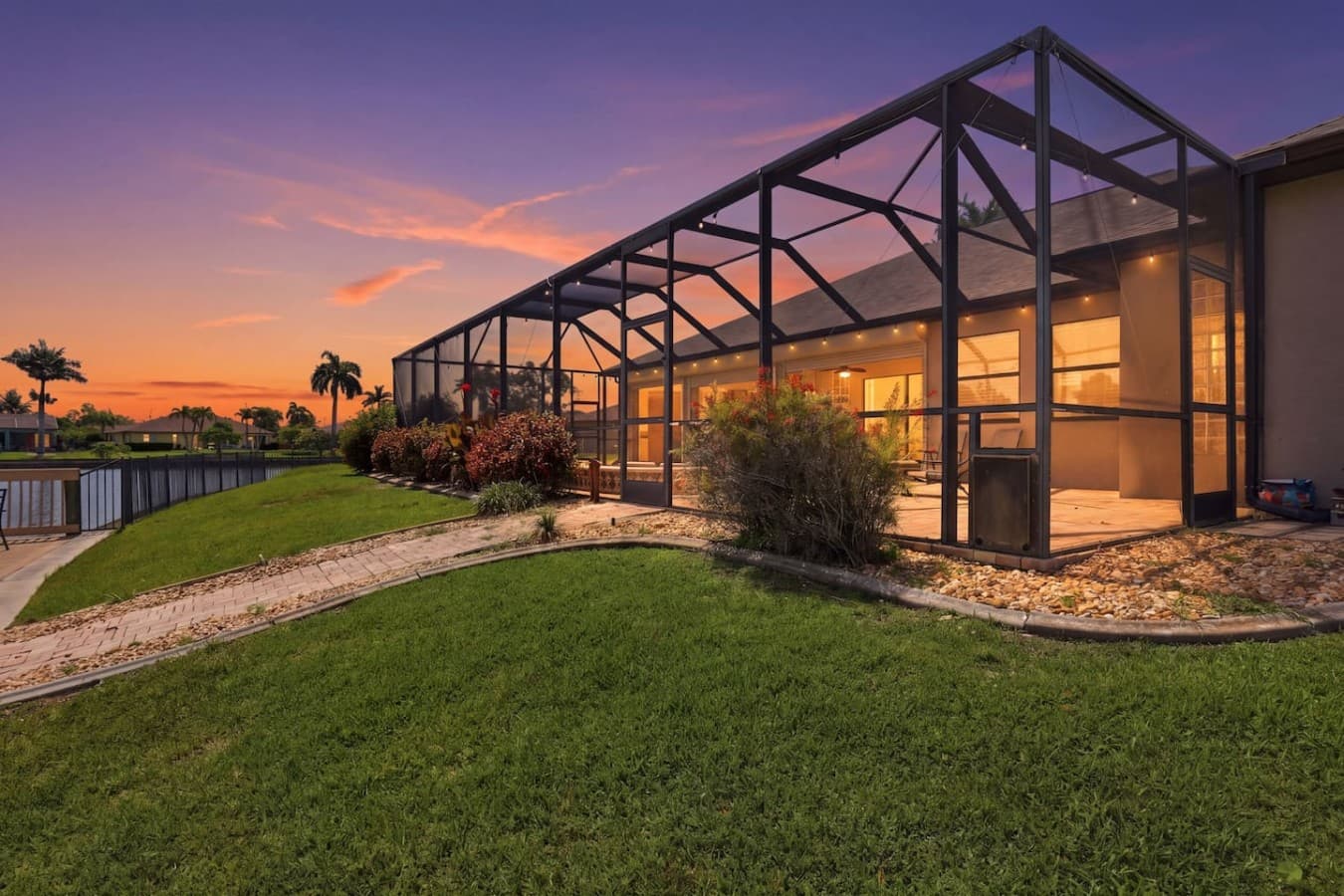 Screened lanai overlooking the water with plenty of room to relax and enjoy the sunset.