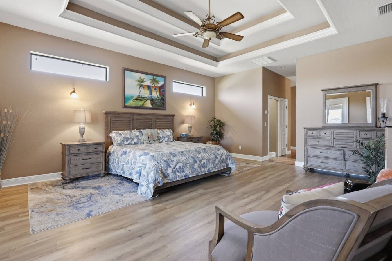 Spacious primary bedroom with vaulted ceilings and plenty of room to relax.