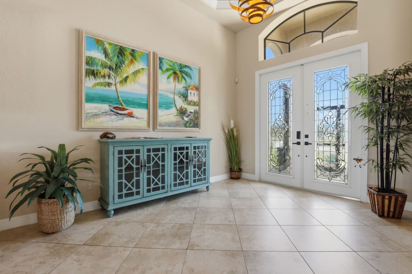 Bright front entryway with coastal decor and welcoming natural light.