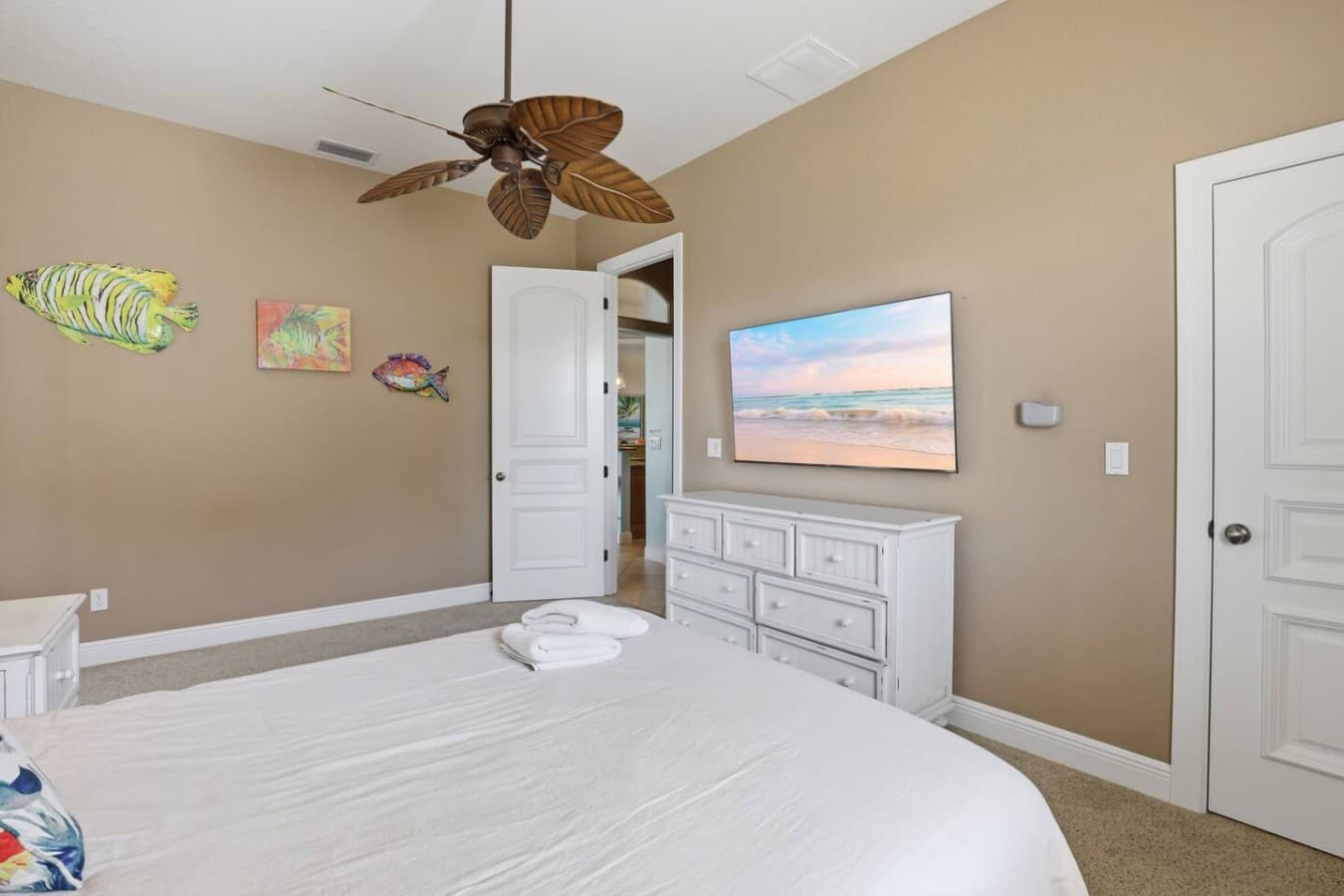 Relaxing guest room with plush bedding and plenty of space to unwind after a day in the sun.