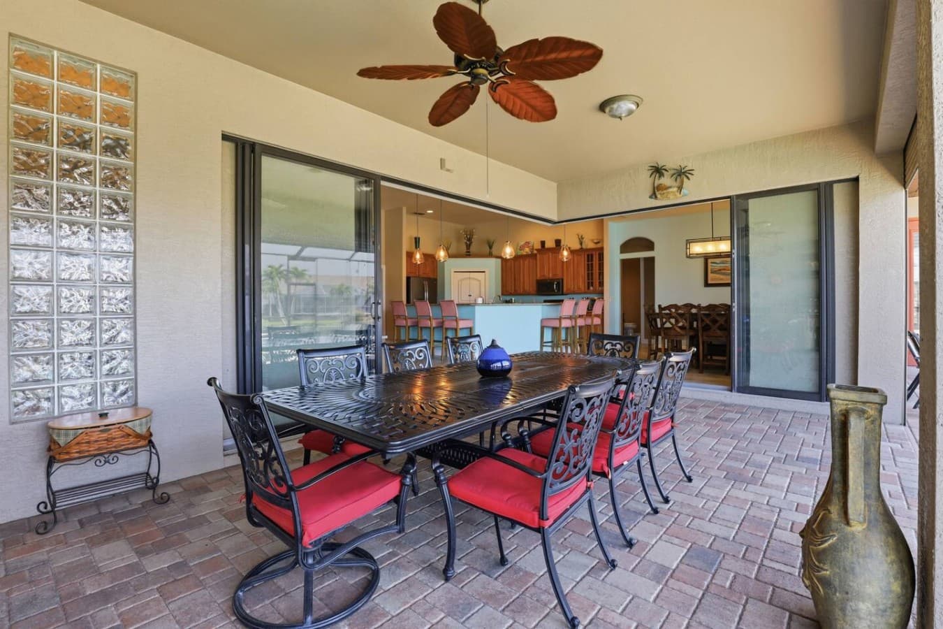 Covered outdoor dining area perfect for al fresco meals with waterfront views.