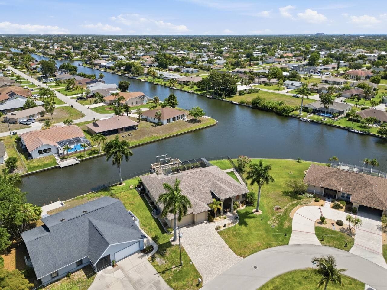 Aerial views showcasing the canal front location and surrounding neighborhood waterways.
