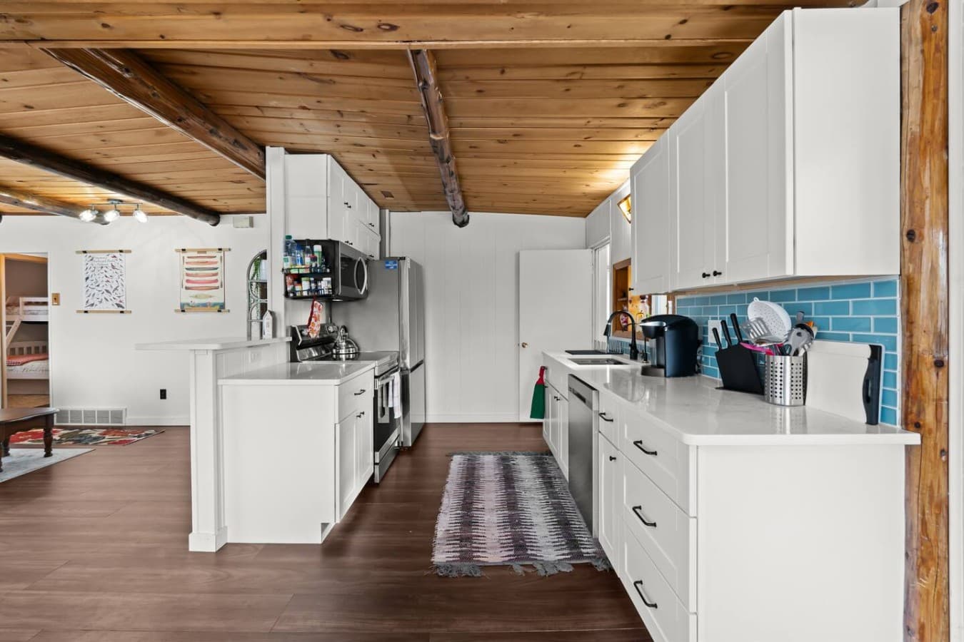 Long galley style kitchen with ample storage and workspace.