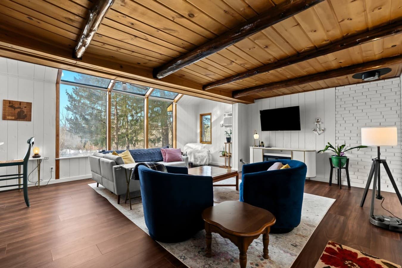 Bright lounge area with large windows and plenty of natural light.