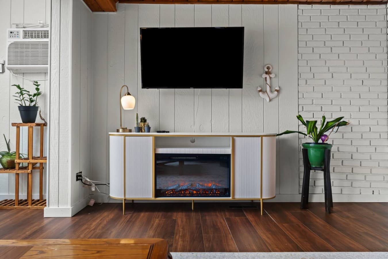 Modern electric fireplace with mounted TV for relaxing evenings.