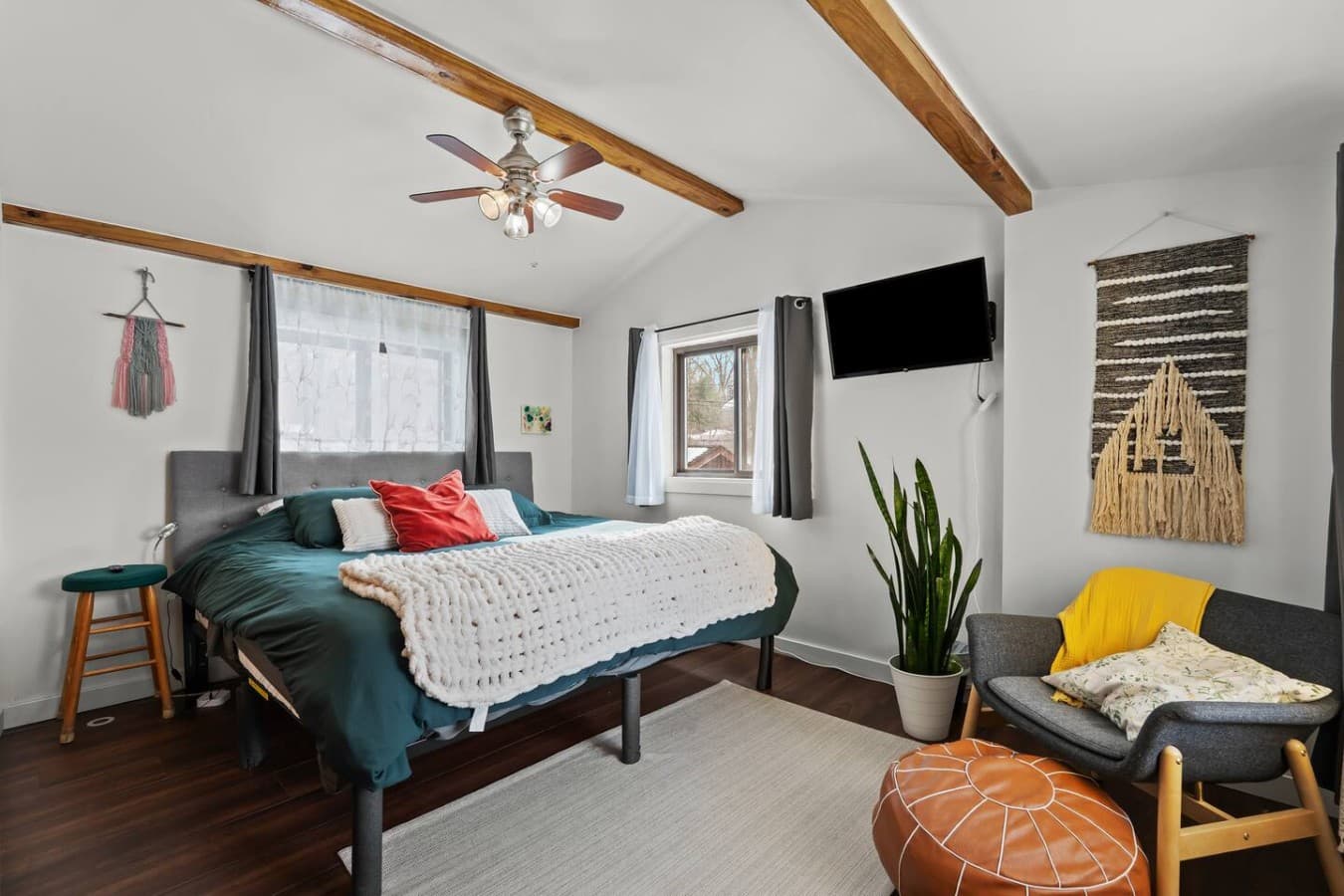 Peaceful bedroom retreat with natural light and simple modern touches.
