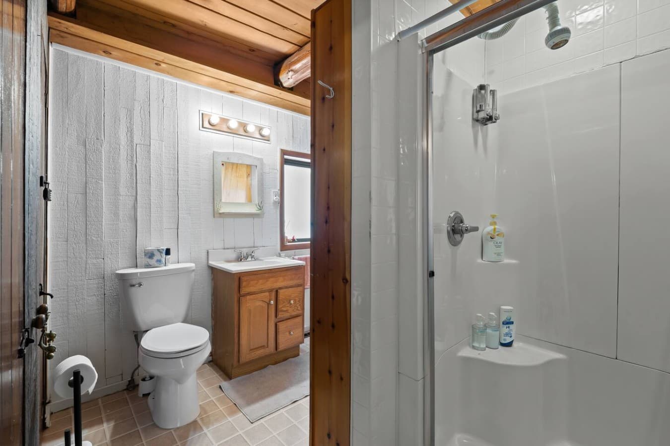Clean shower and bath area with fresh towels provided.