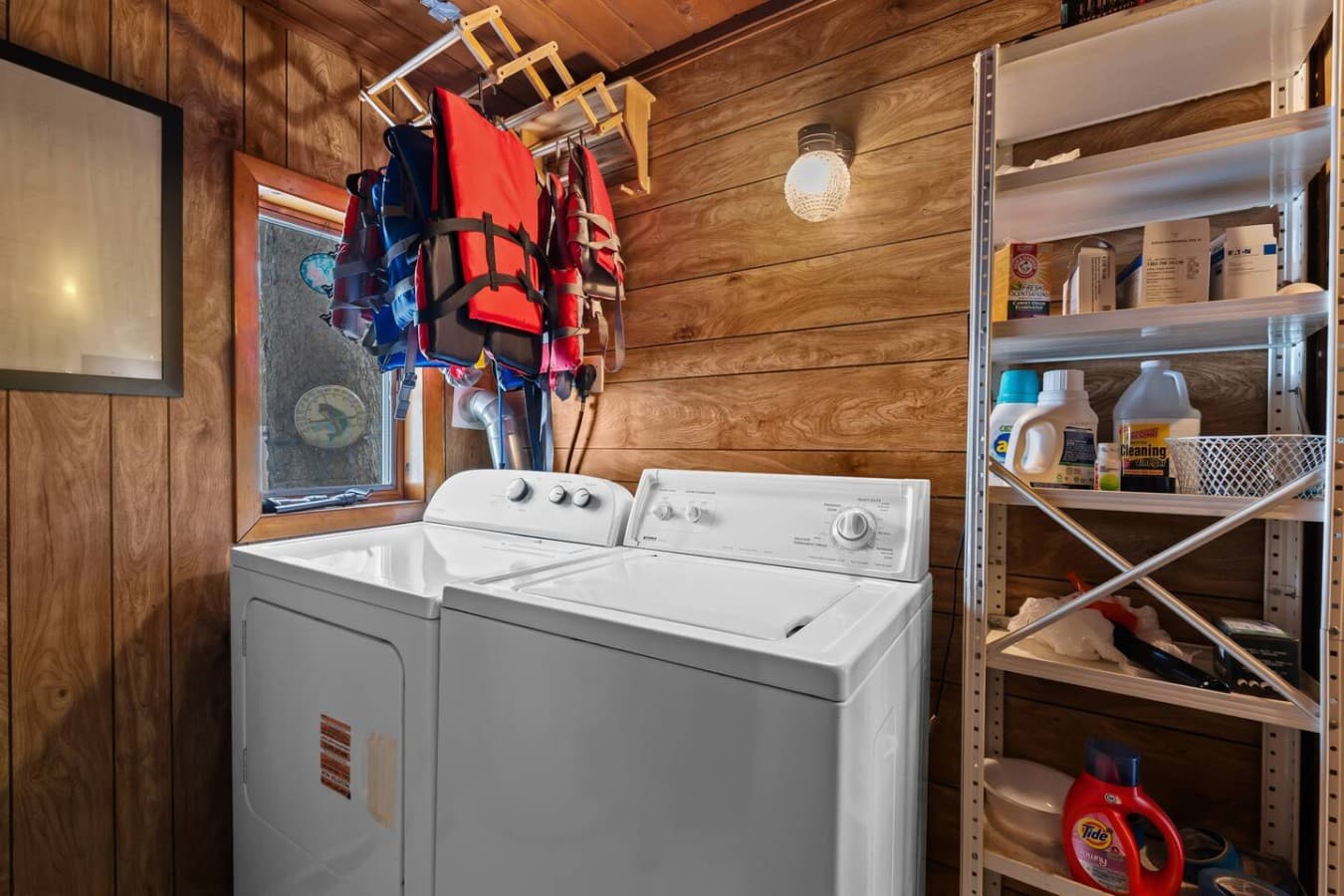 Spacious utility room with extra storage and outdoor gear space.