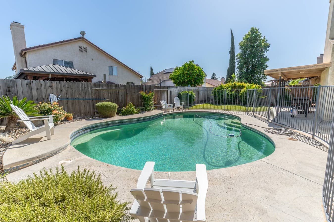 Private backyard pool perfect for sunny afternoons and relaxing swims.