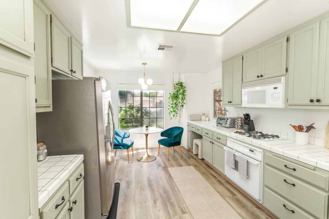 Open concept kitchen with a bright and airy layout for gathering together.