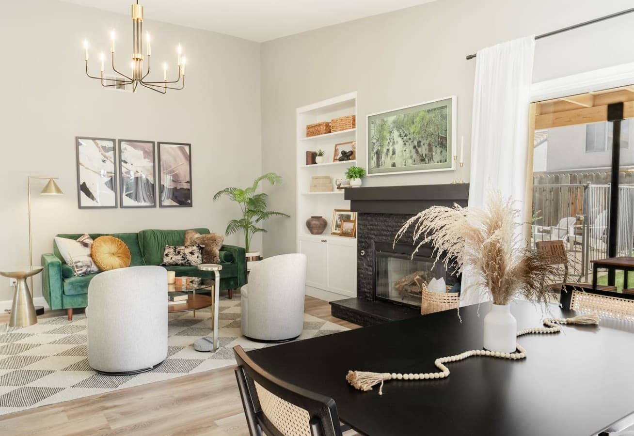 Cozy living room with stylish seating and a warm fireplace.