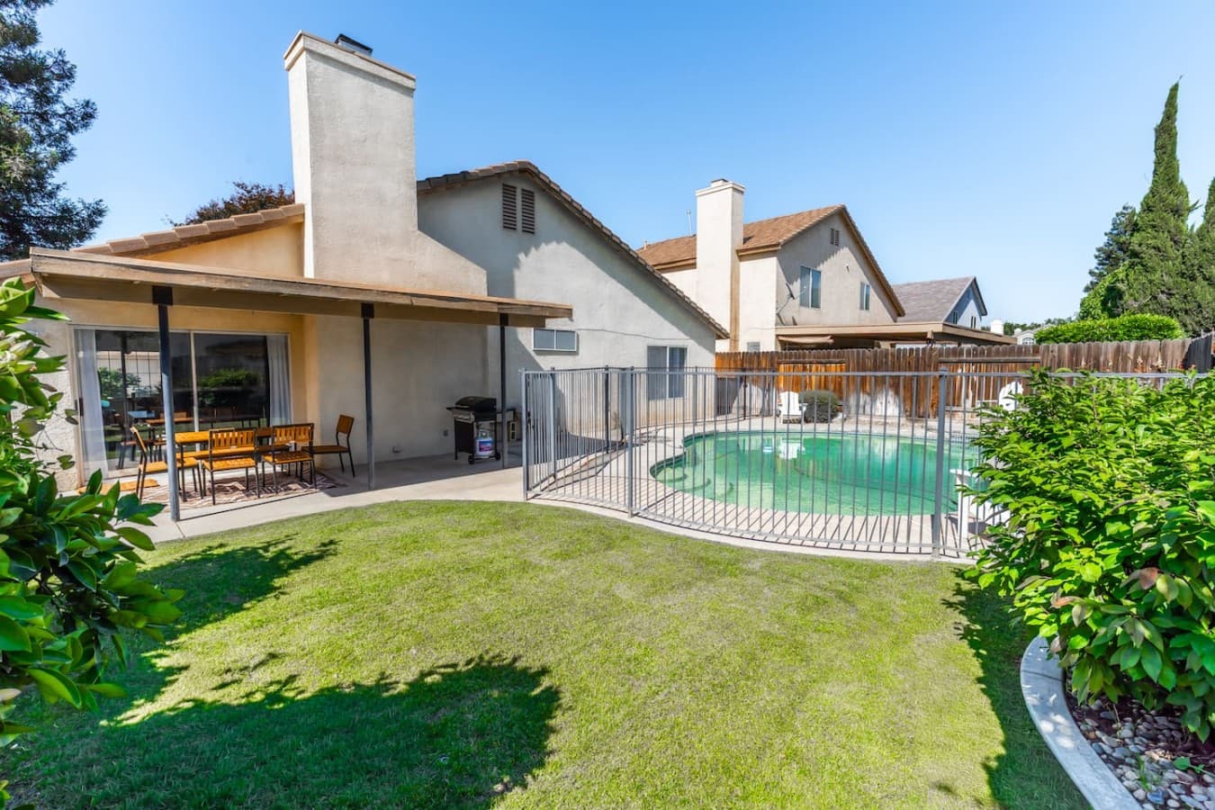 Spacious backyard with a private pool and plenty of room to relax.