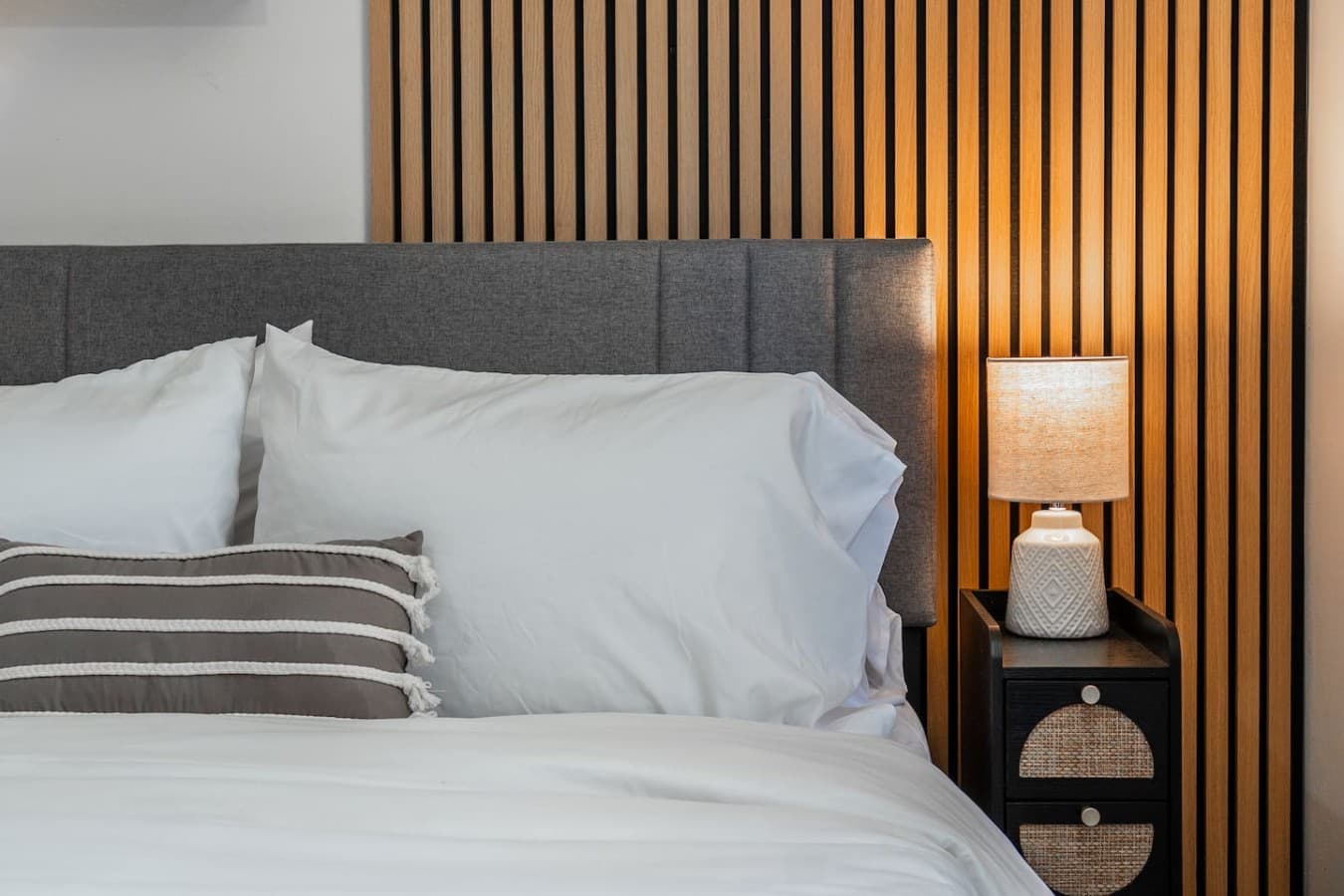 Comfortable bedding and modern design details for a restful stay.