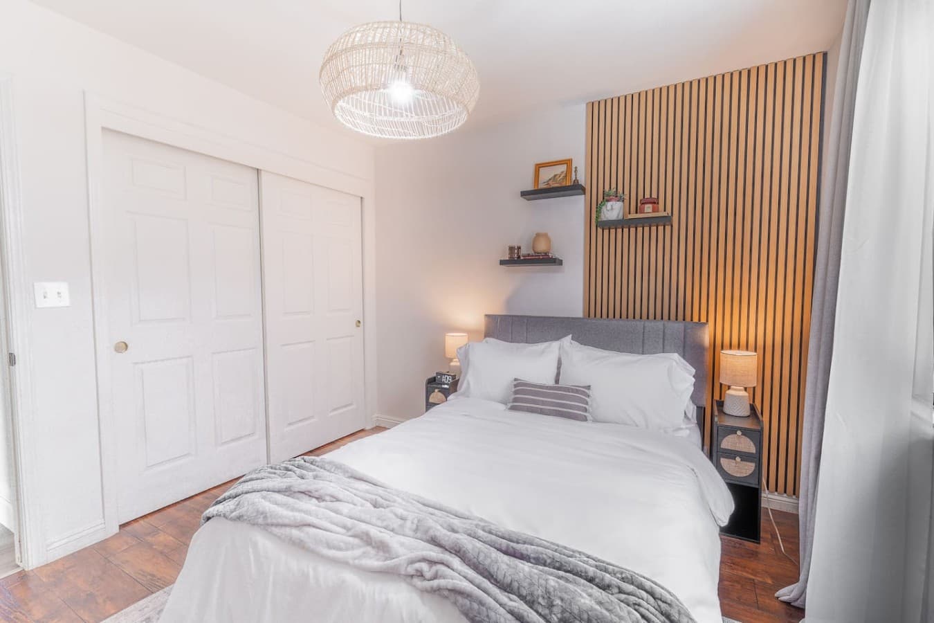 Relaxing guest bedroom with soft tones and natural light.