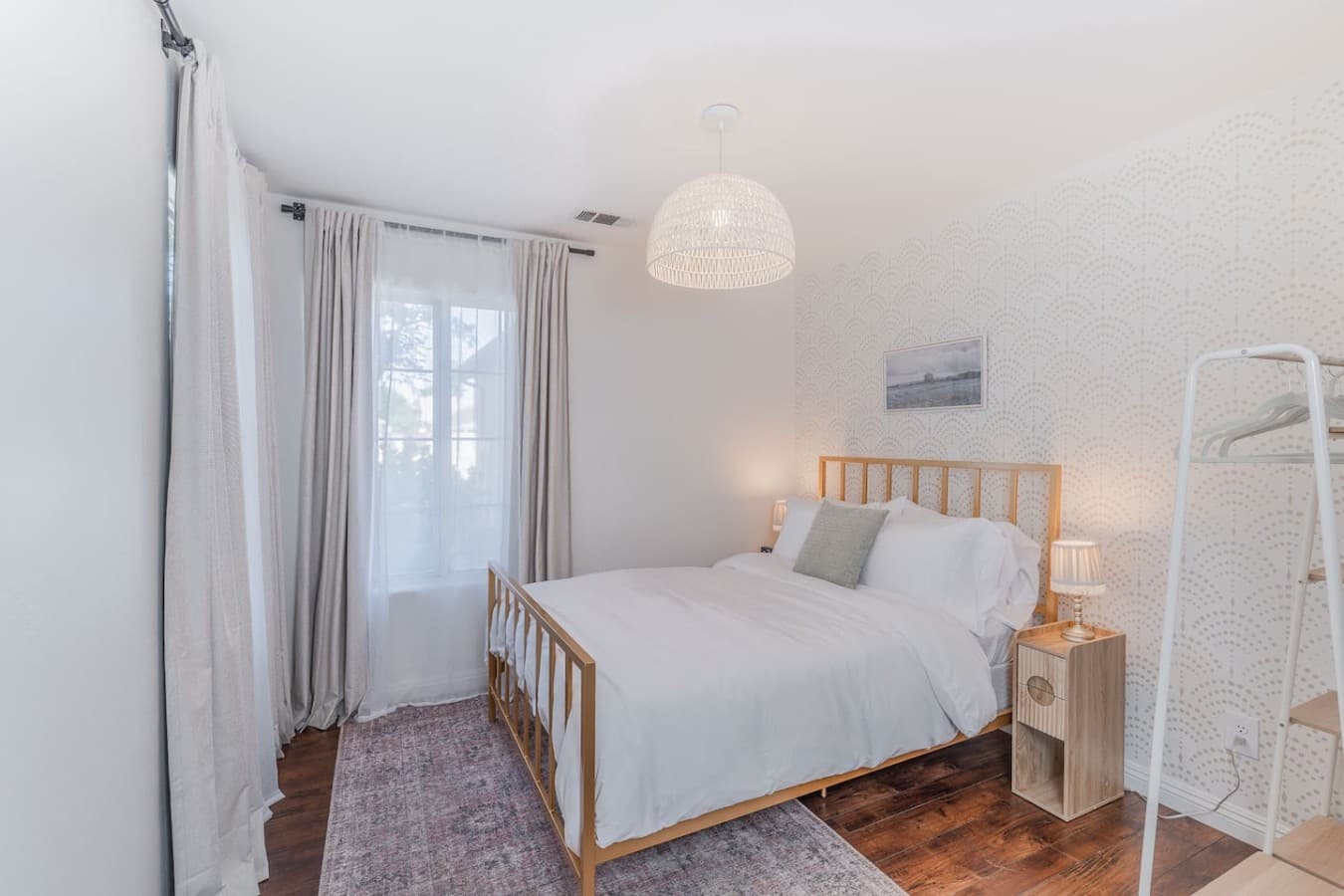 Additional guest bedroom with comfortable sleeping arrangements and natural light.