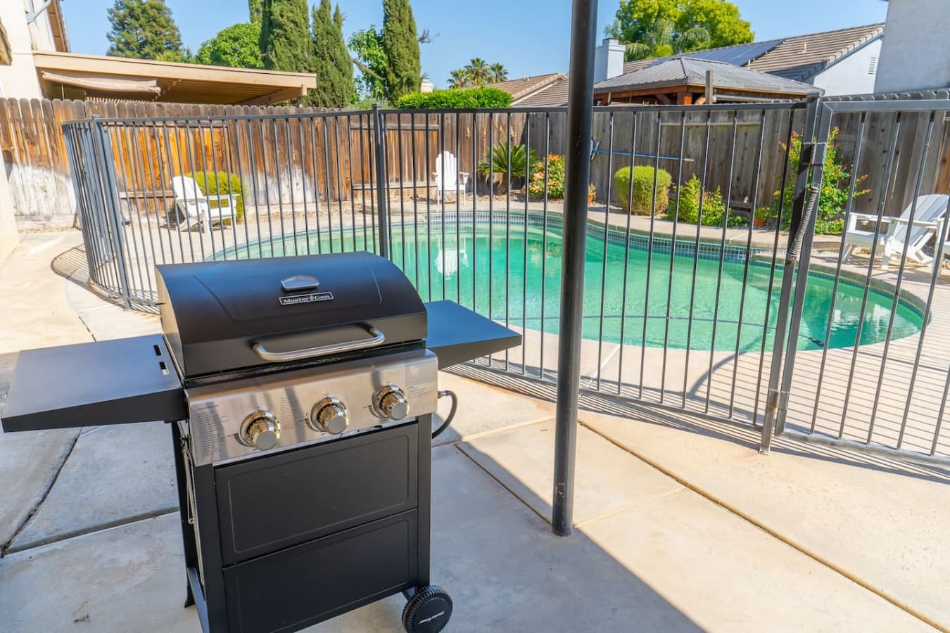 Covered outdoor dining area perfect for meals by the pool.