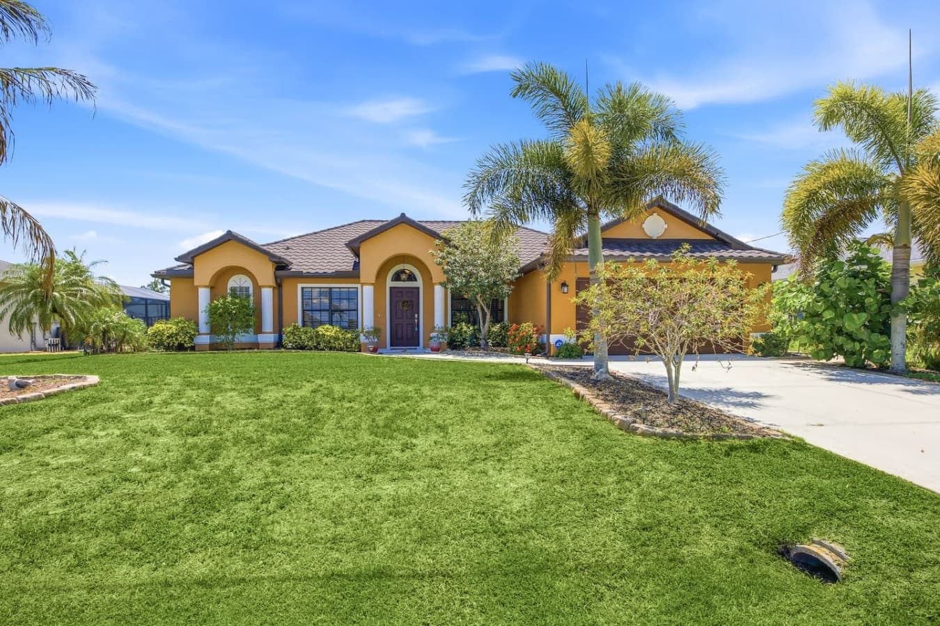 Beautifully landscaped front exterior with charming curb appeal and a welcoming entrance.