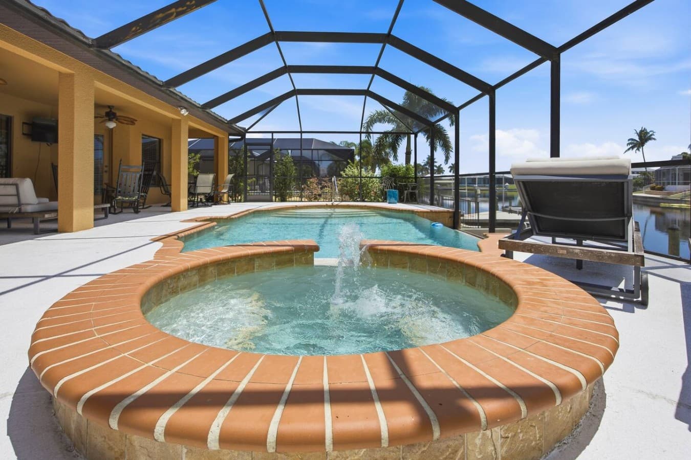 Inviting screened pool and spa offering the perfect setting for relaxing and entertaining.