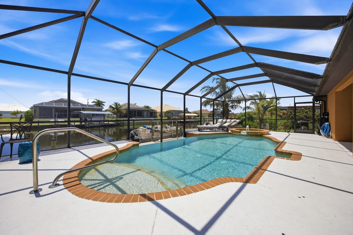 Private screened pool with a spacious sun deck overlooking the canal.