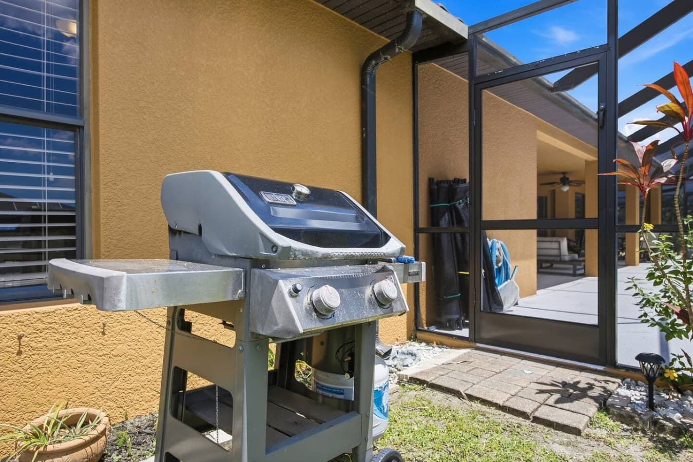 Outdoor grilling area conveniently located just outside the covered lanai.