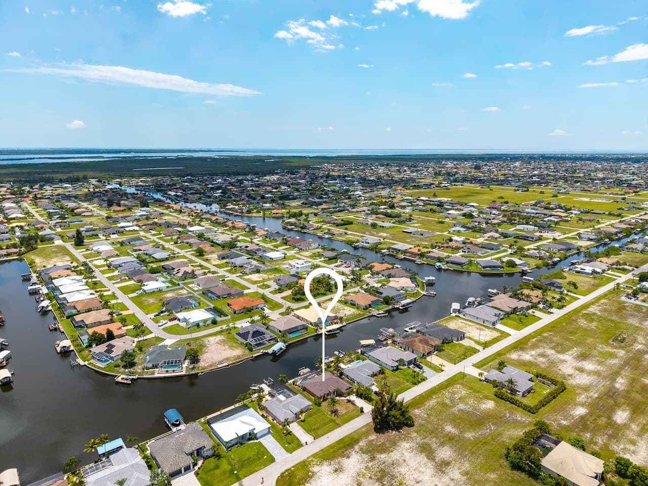Elevated neighborhood view showcasing the property's desirable canal-front setting.