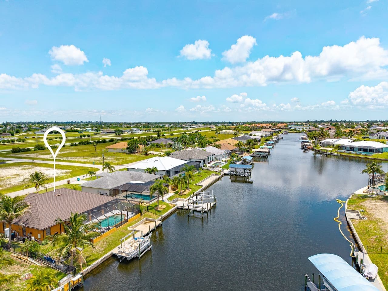 Scenic canal view showcasing direct access to open waterways and nearby homes.