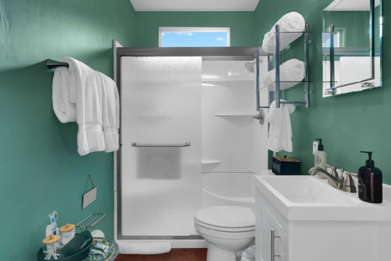 Private bathroom with a walk in shower and fresh towels provided.