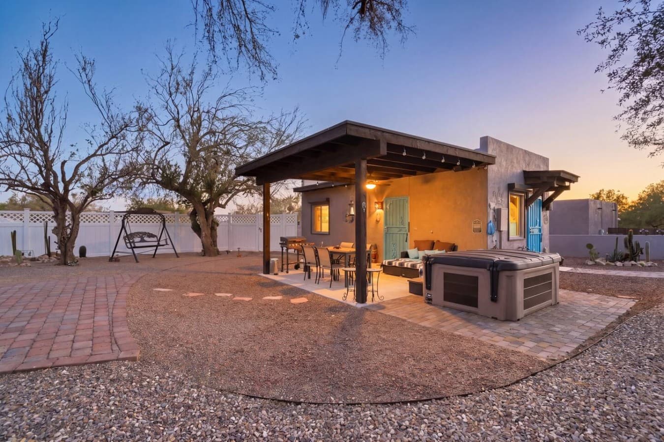 Private detached guesthouse with a cozy patio, hot tub, and peaceful desert evenings.