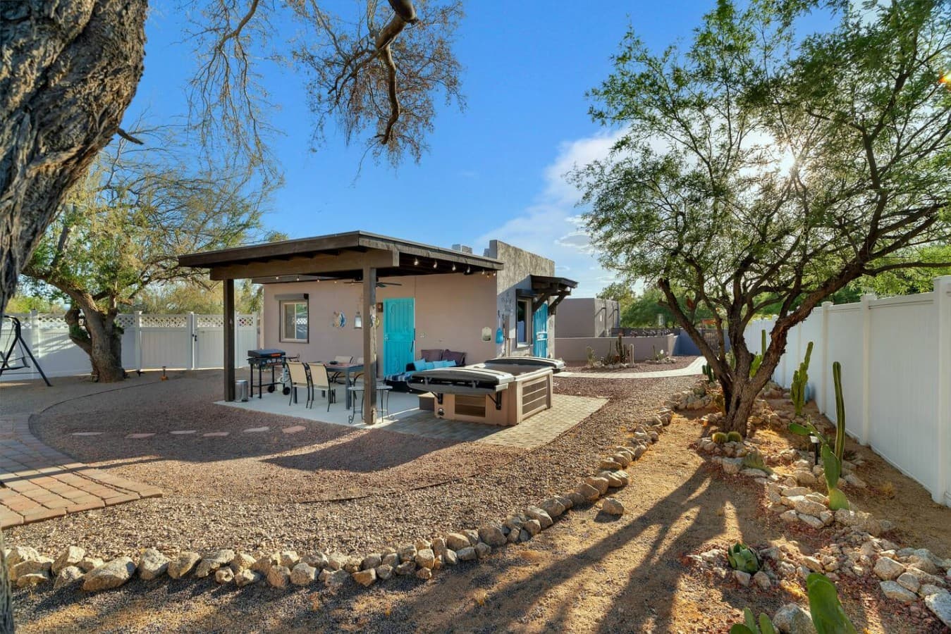 Spacious backyard with a private guesthouse, outdoor seating, and plenty of room to unwind.