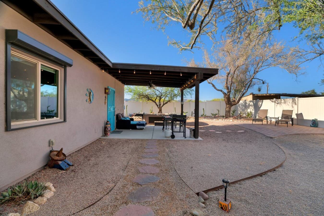 Peaceful outdoor space with covered patio dining and cozy evenings outside.