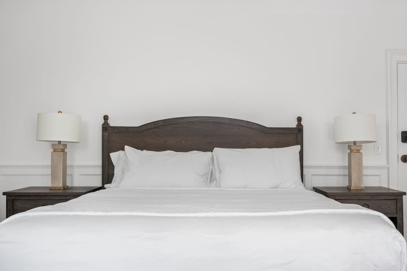 This is the private room you will be renting showcasing a clean king bed setup with simple and calming design.