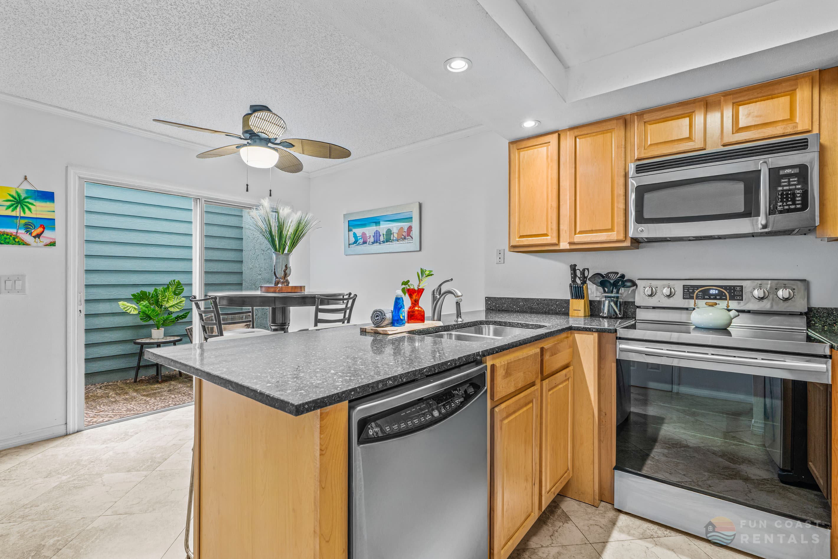 Fully-Equipped Stainless Steel Kitchen with Bar Seating