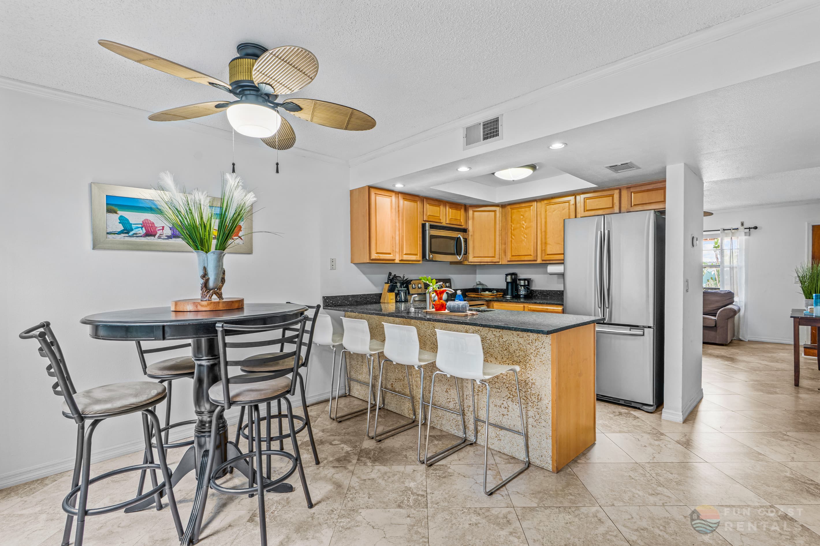 Fully-Equipped Stainless Steel Kitchen with Bar Seating