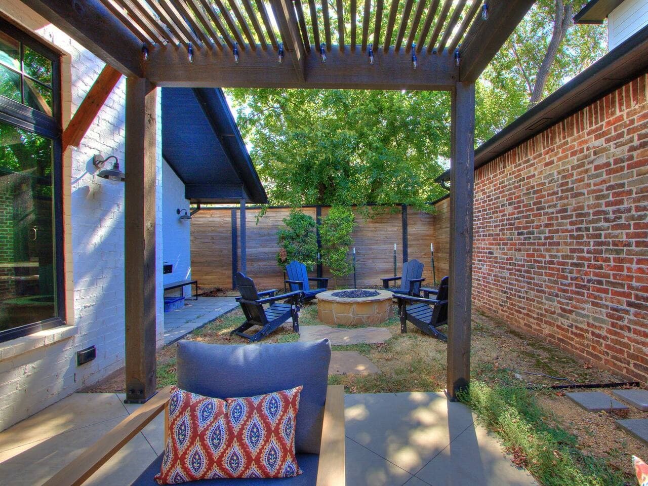 Enjoy an easy transition from the covered patio to the backyard fire pit for laid back outdoor gatherings.