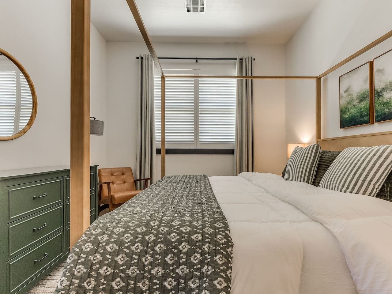 Comfortable bedroom with natural light, thoughtful furnishings, and a cozy place to relax.
