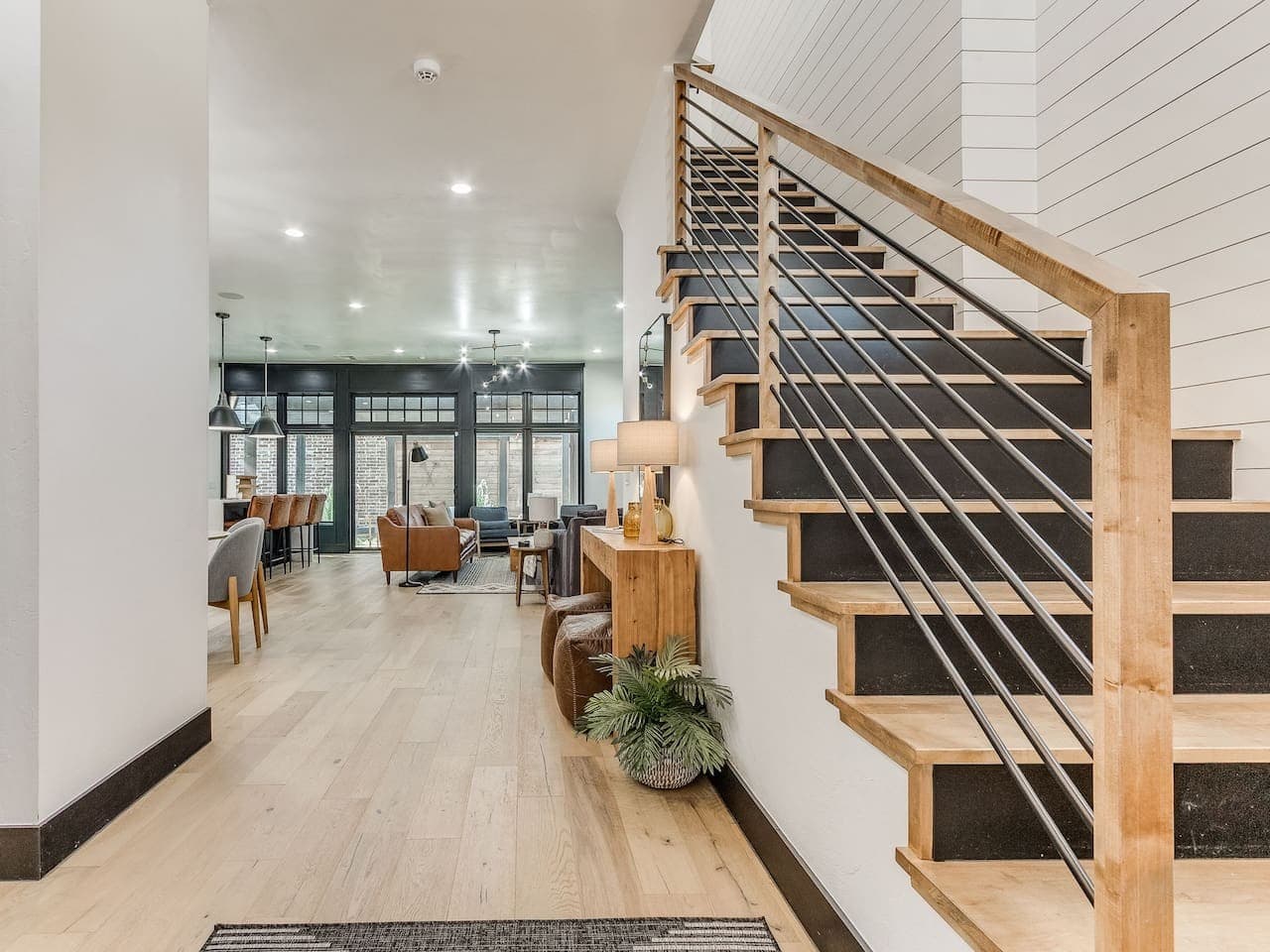 Open entryway flows seamlessly into the spacious living, dining, and kitchen areas.