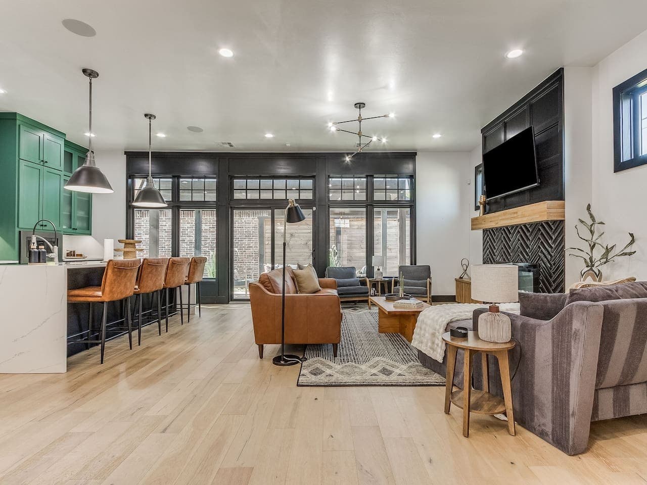 Spacious open concept living room with comfortable seating and seamless access to the kitchen and dining areas.