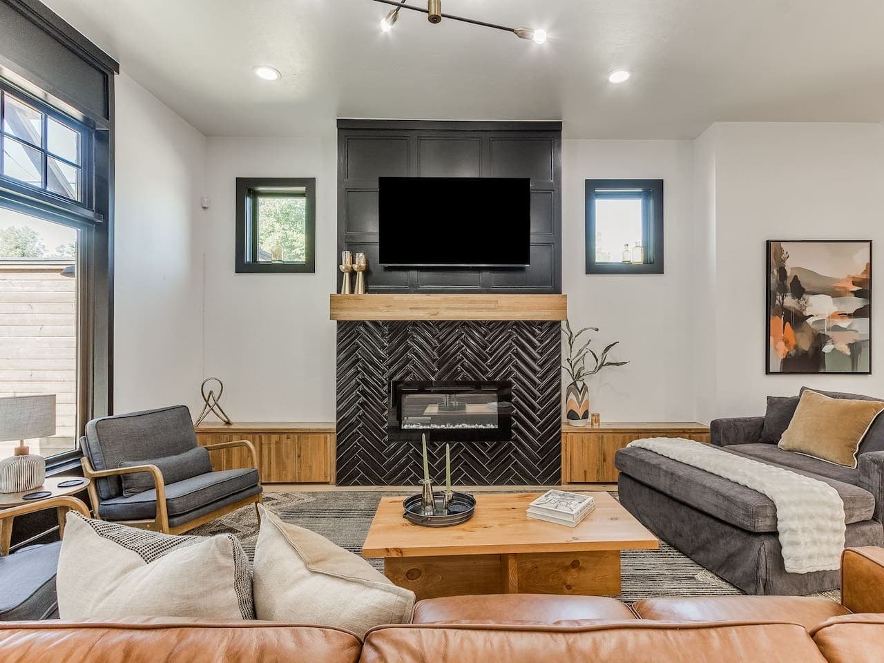 Gather around the striking fireplace and mounted TV for a cozy evening at home.