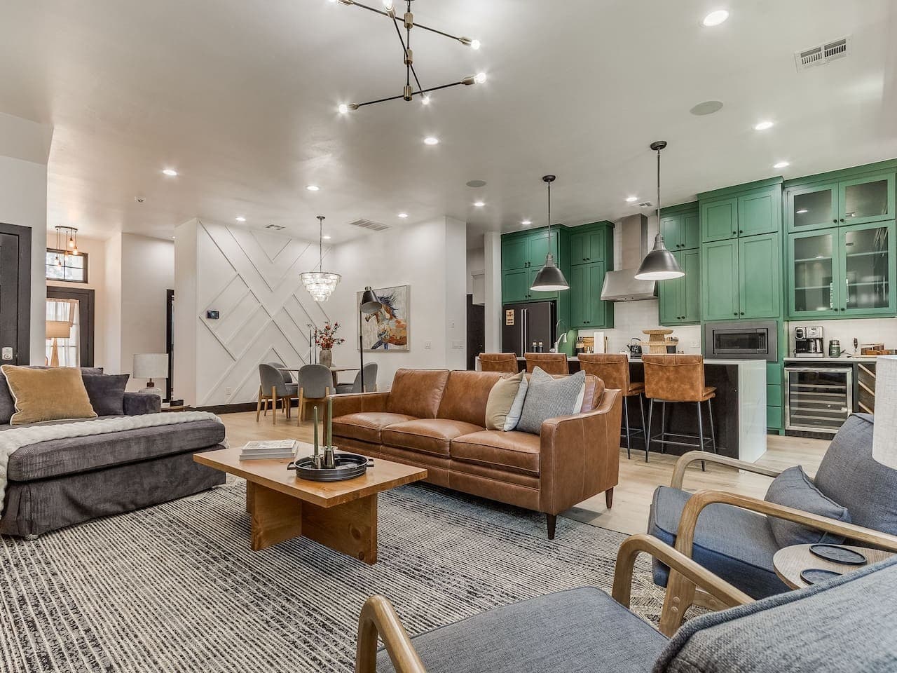 Stylish open concept living area connecting the lounge, dining space, and vibrant kitchen for effortless group gatherings.