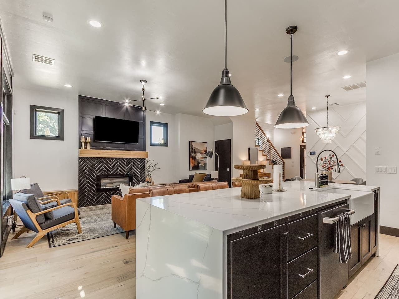 A spacious kitchen island anchors the open living area and creates a natural gathering place for guests.
