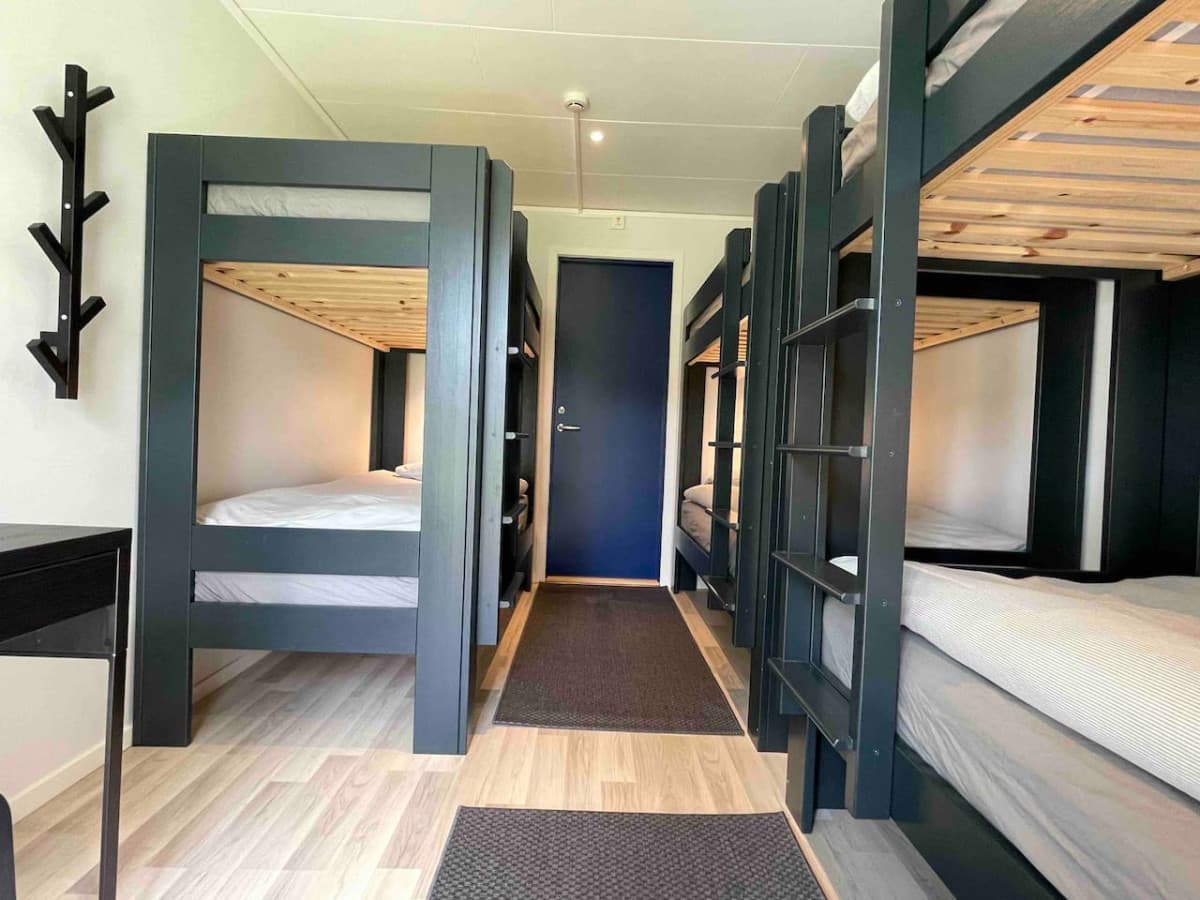 Bedroom with three bunkbeds that sleep 6 persons. There are five identical rooms.