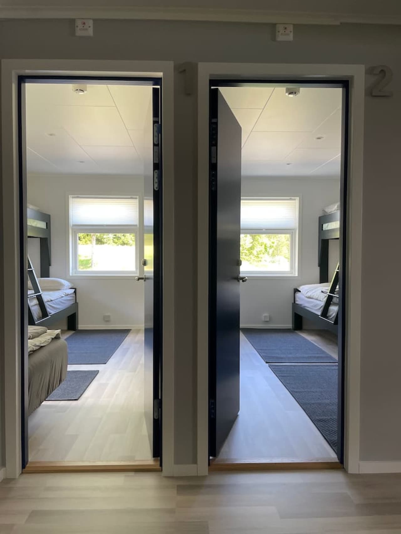 View of bedrooms in main building. One bedroom sleeps 4 and the second bedroom sleeps 6.