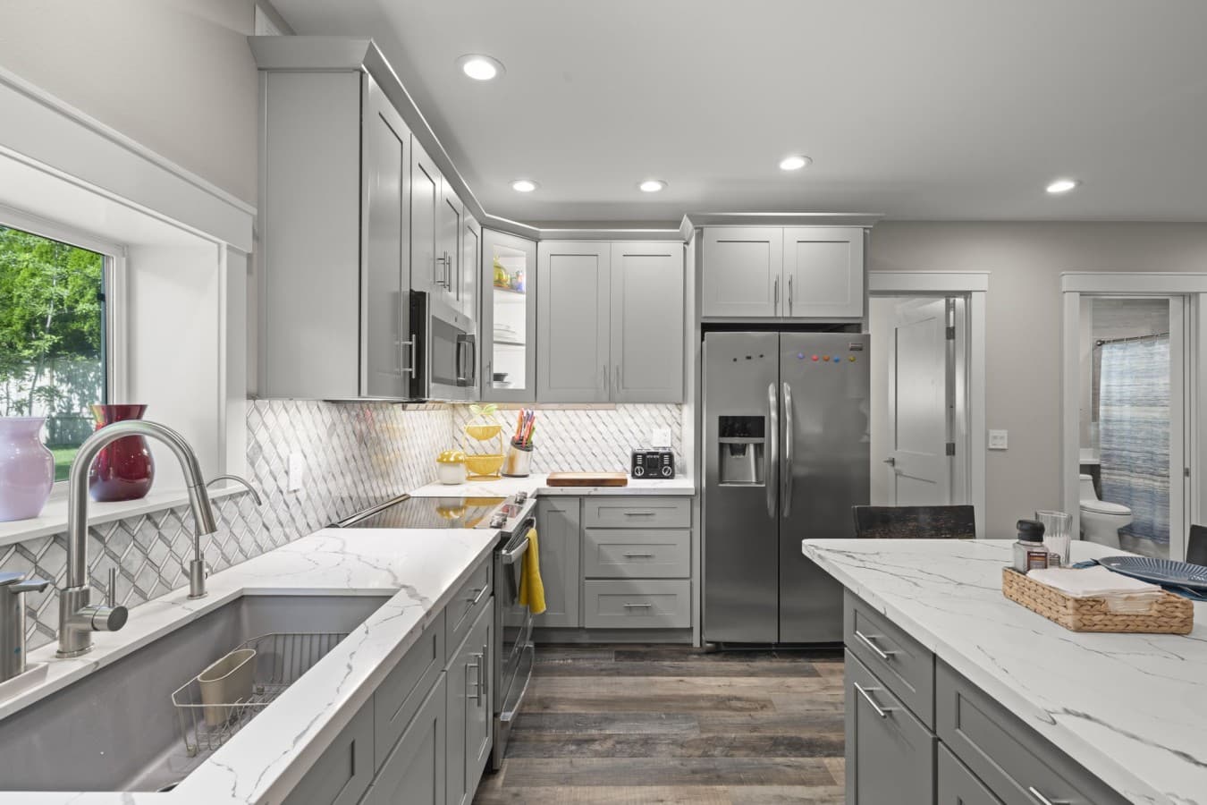 Bright, modern kitchen with generous counter space and stainless-steel appliances.jpg