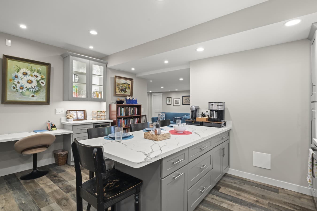 Open-concept kitchen with a large island, coffee station, and seating area_.jpg
