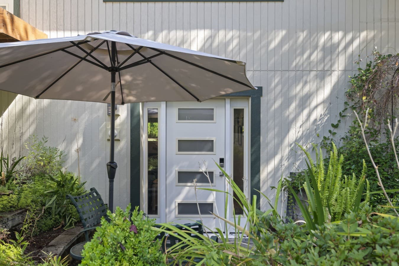Shaded patio beside the private entrance, offering a comfortable place to unwind outdoors_.jpg