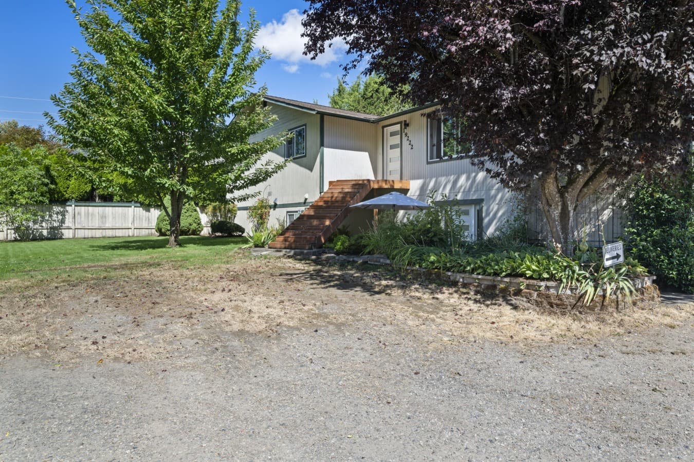 Exterior view of the property with mature trees, greenery, and convenient on-site parking_.jpg