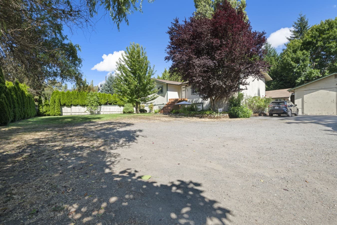 Exterior view of the property, surrounded by mature trees and beautiful greenery_.jpg