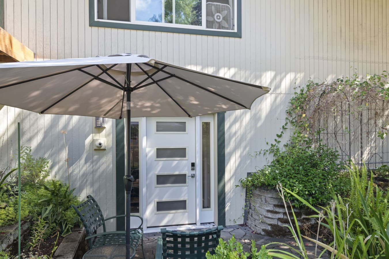 Private entrance with keyless access and a shaded outdoor seating area_.jpg